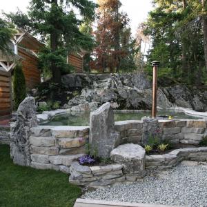 Whistler backyard pond and natural stone landscape by Terracraft
